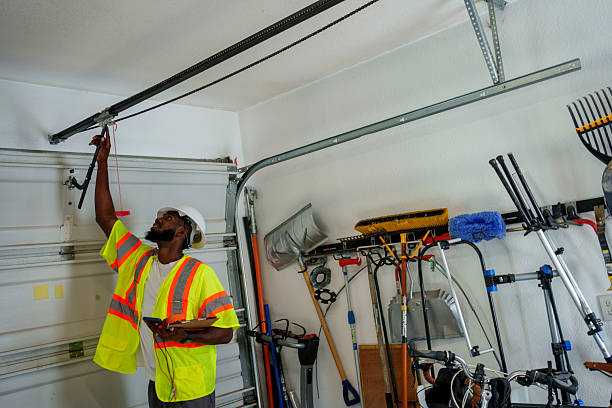 Professional Garage Door Panel Replacement technician working in Wamac, IL